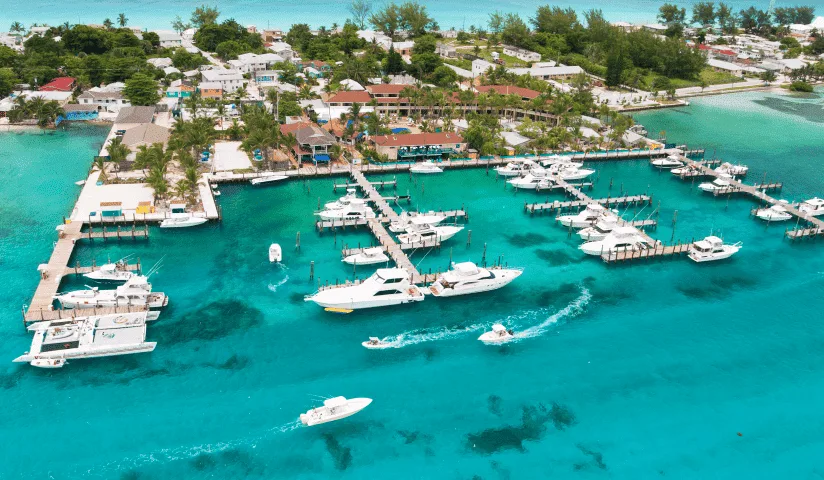 Aerial view of the marina and docks at Bimini Big Game Club in Alice Town, with sportfishing boats along the piers